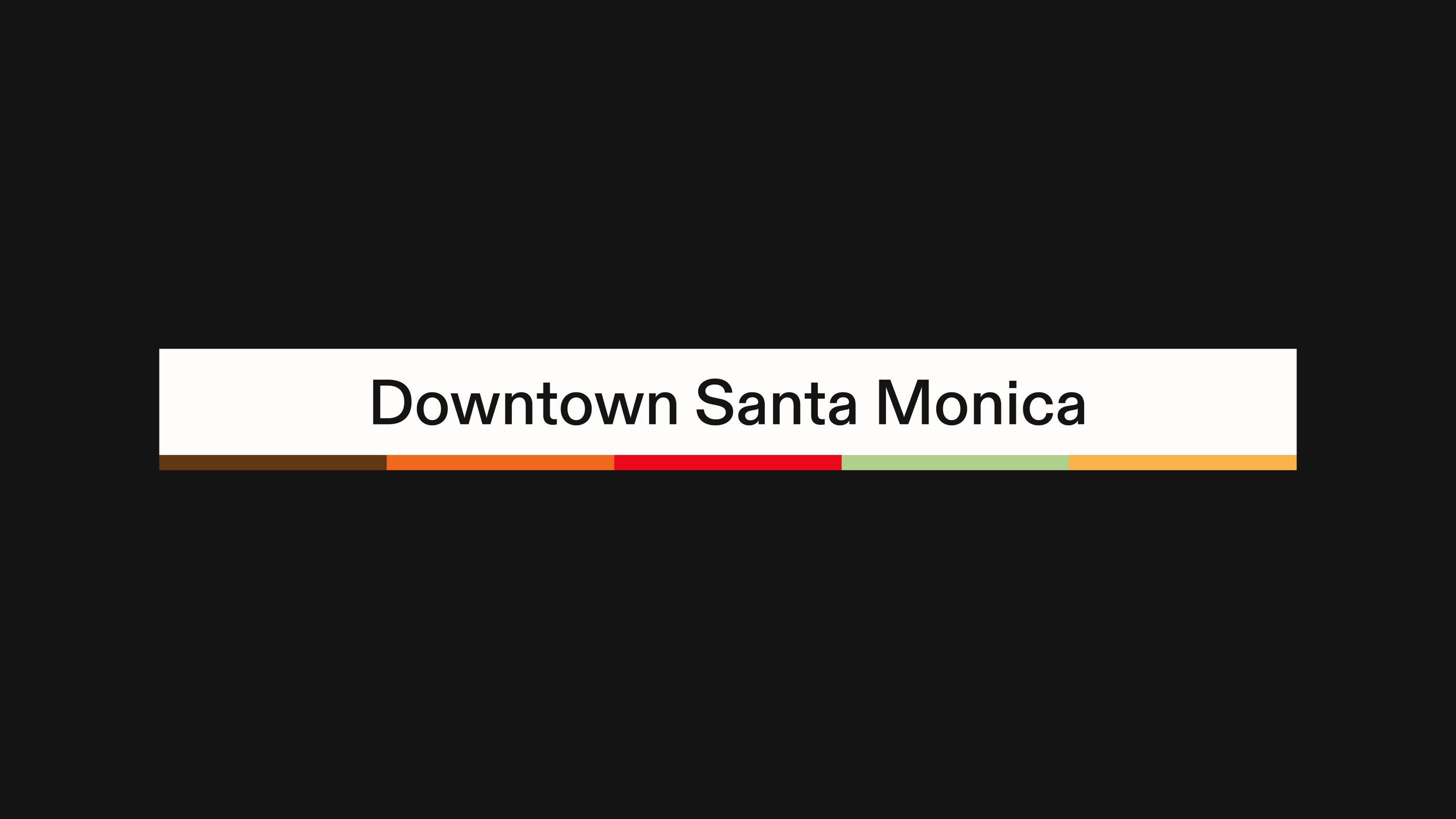 A station name sign with its line colours beneath, 5 of 6.